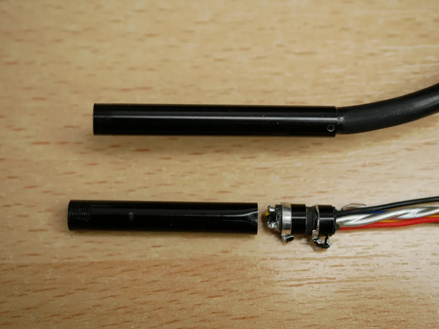  Endoscope housing new (above) and cut open (below) 
