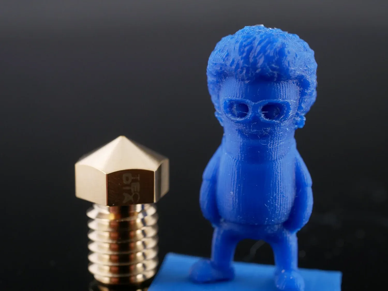 Close-up of the tiny Marvin, glasses and hair texture legible at this scale