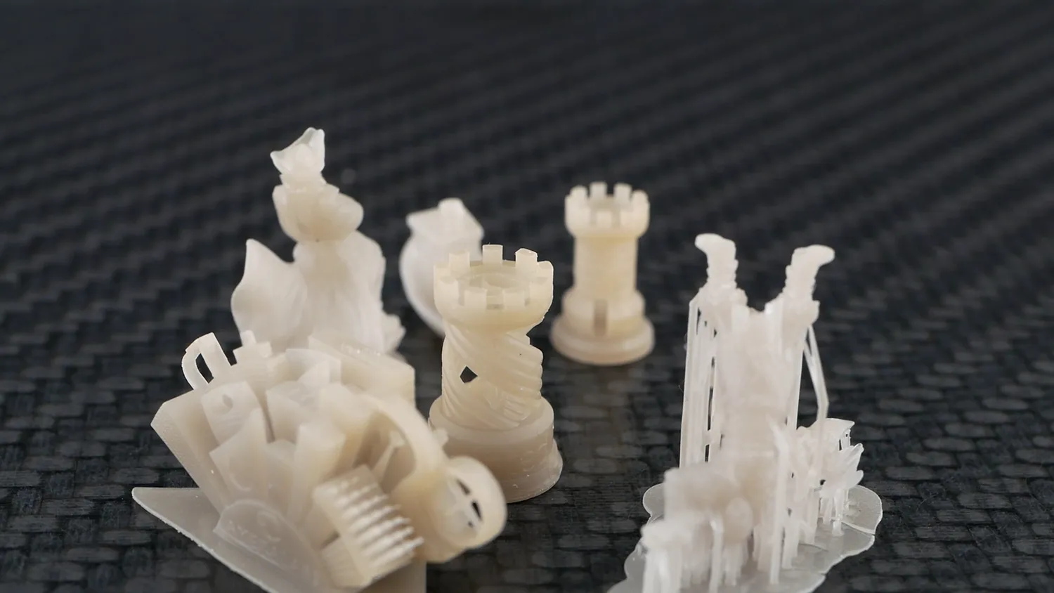 The same models printed in resin on the Elegoo Mars, sharper again with visible support scaffolds