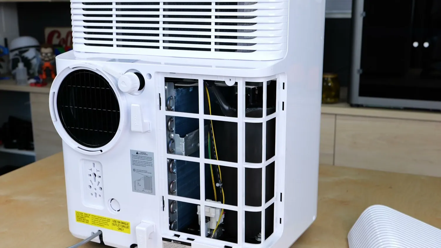 Rear of a portable air conditioner with the intake screen removed
