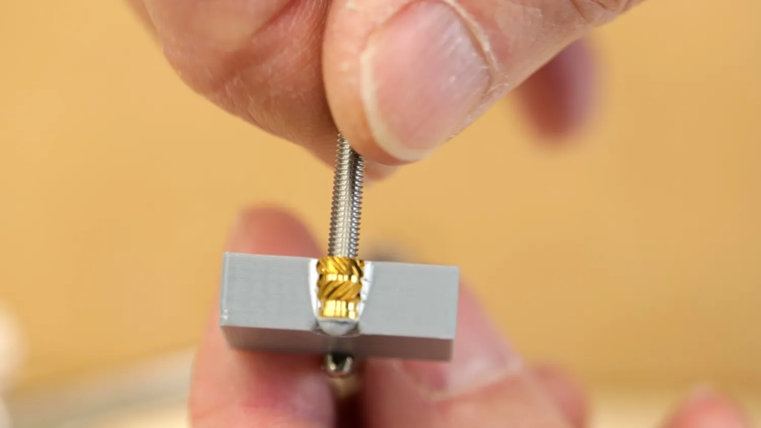 Insert melted into an undersized hole with plastic pushed out of the way