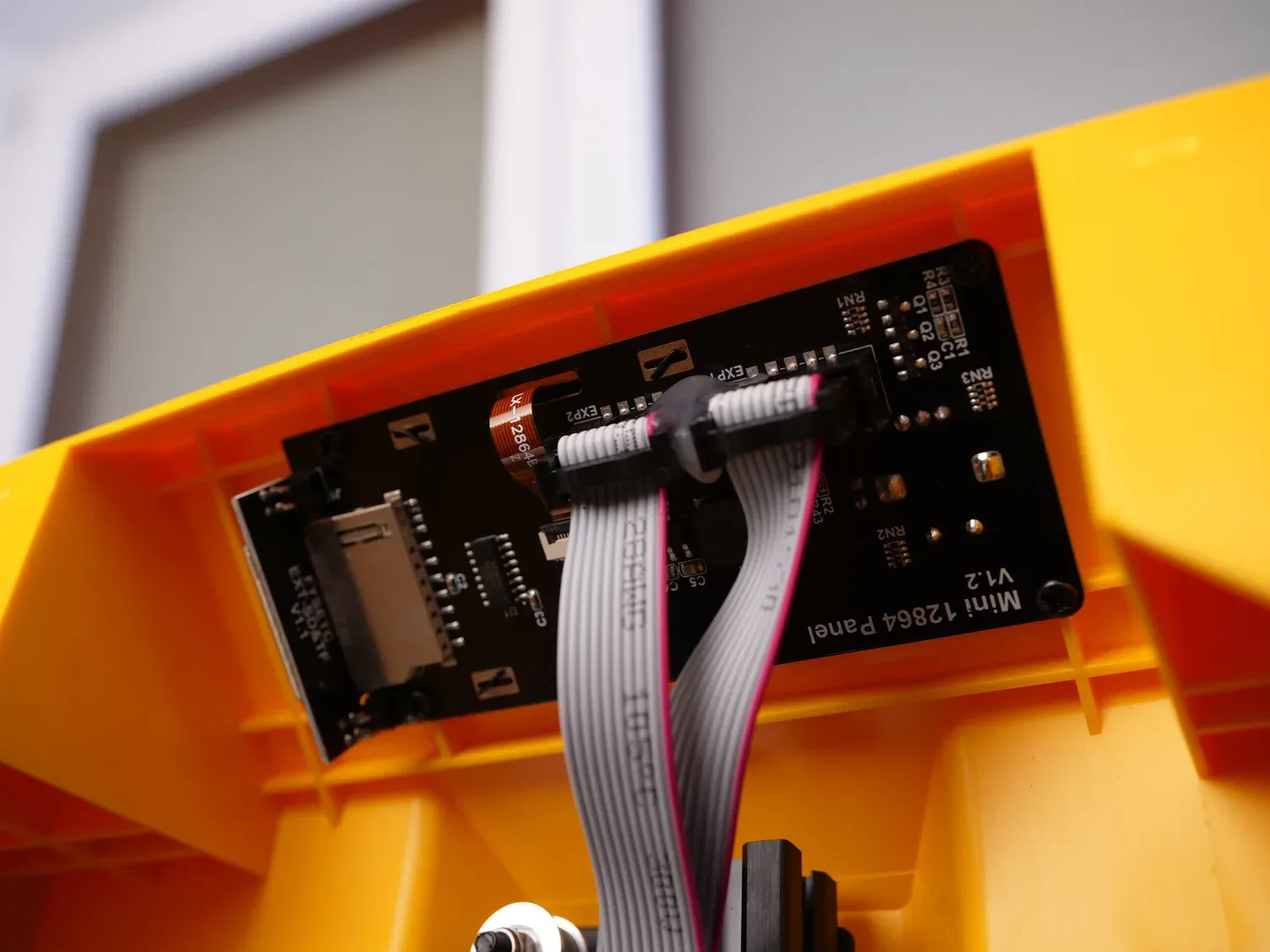 The Mini 12864 display panel behind the front cover, with its SD slot and ribbon cables