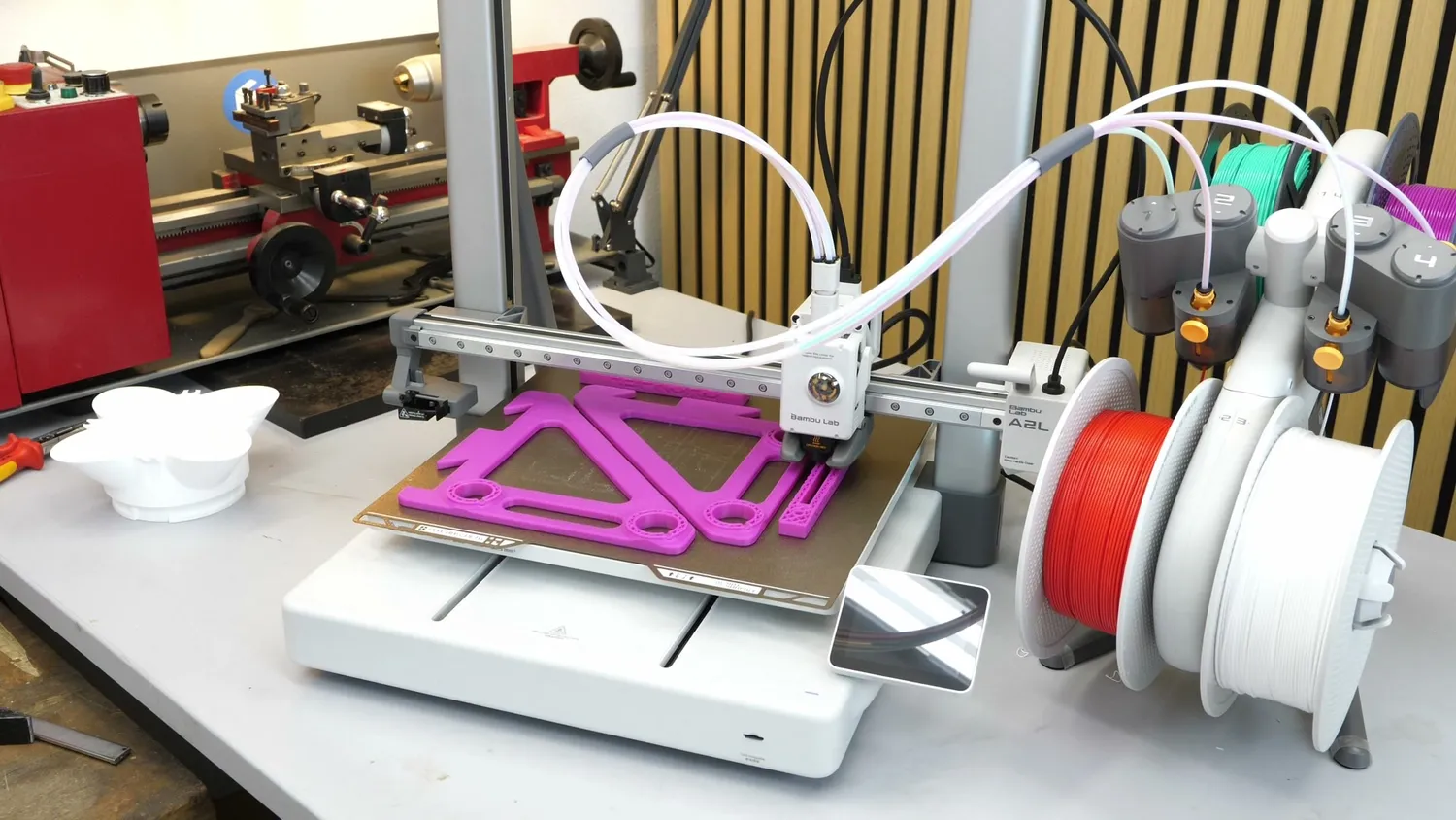 The A2L printing a flat part while the bed moves back and forth