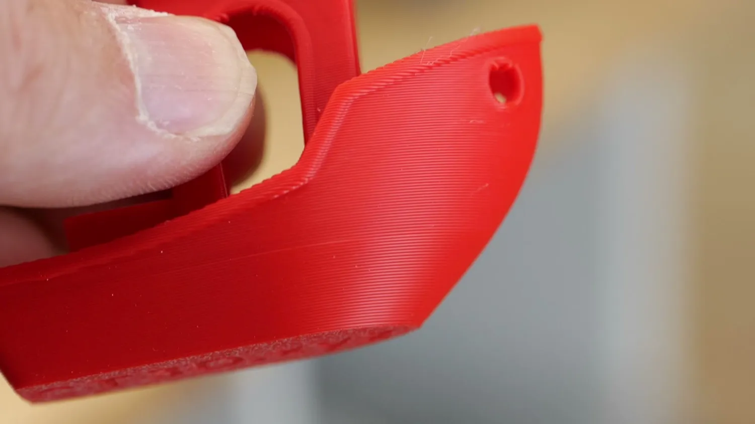 Close-up of the hull of a red 3DBenchy printed on the A2L
