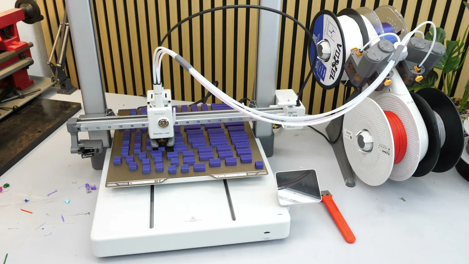 79 small purple parts printing at once on the A2L's build plate