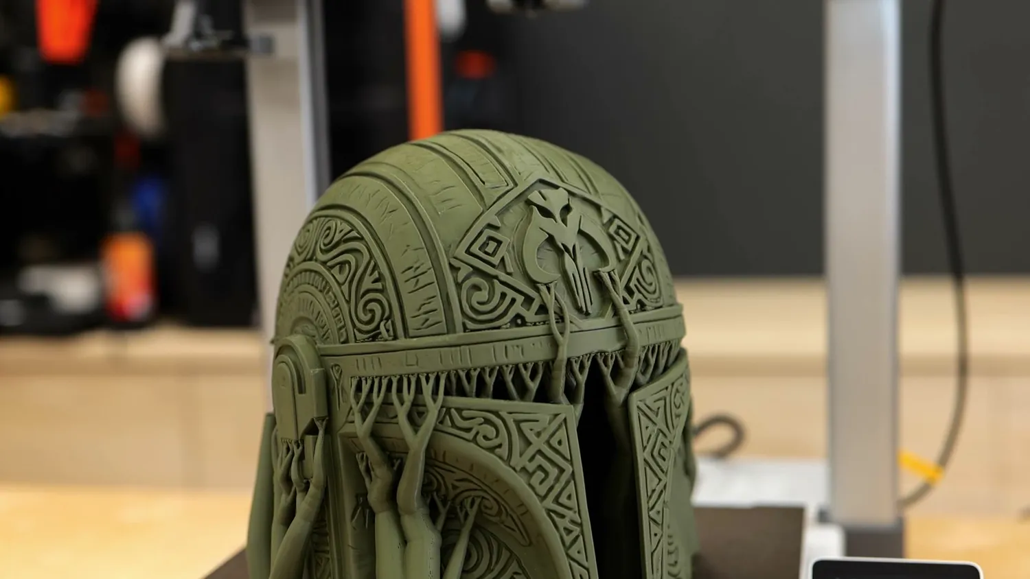 Close-up of the carved detail on the printed Mandalorian helmet