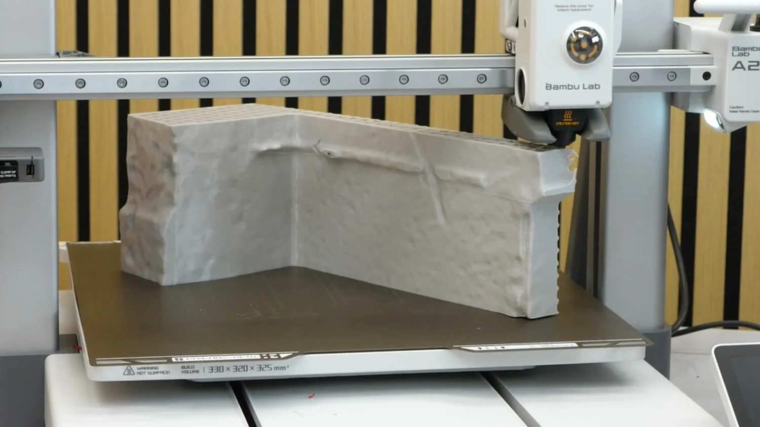 A large PETG ramp section warping up from the build plate