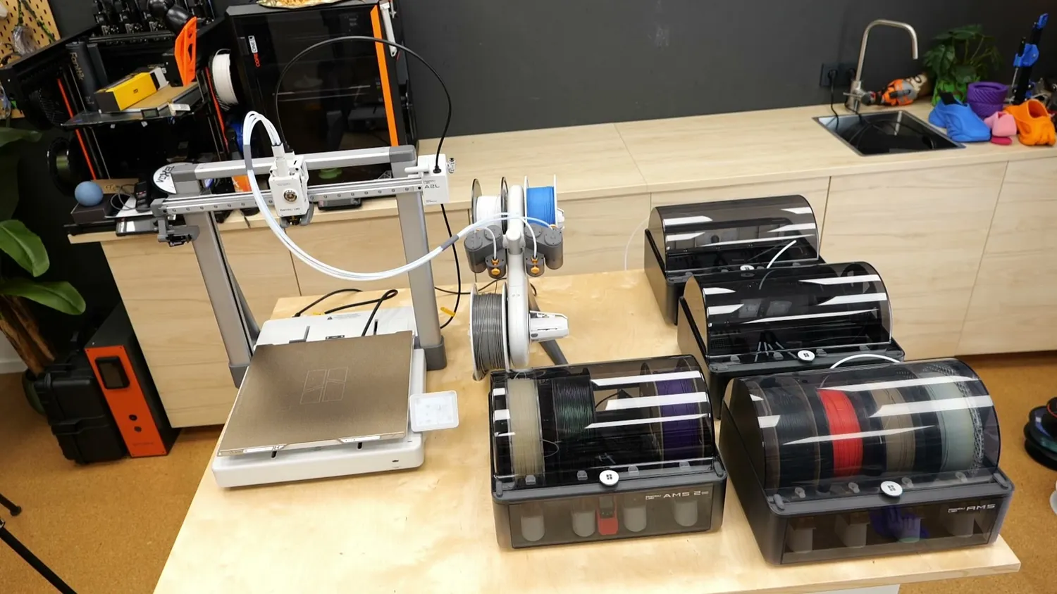 The A2L set up next to several box-style AMS units