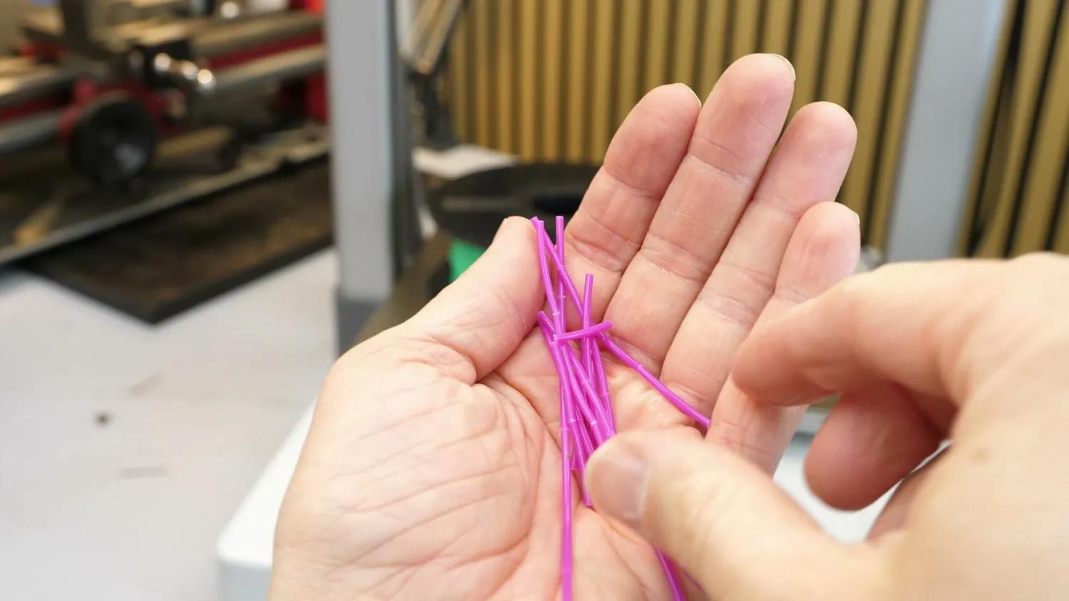 Shattered pieces of brittle filament pulled out of the PTFE tubes