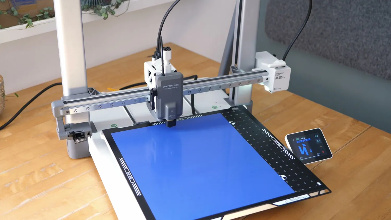 Blue heat-transfer vinyl stuck to the A2L's cutting plate