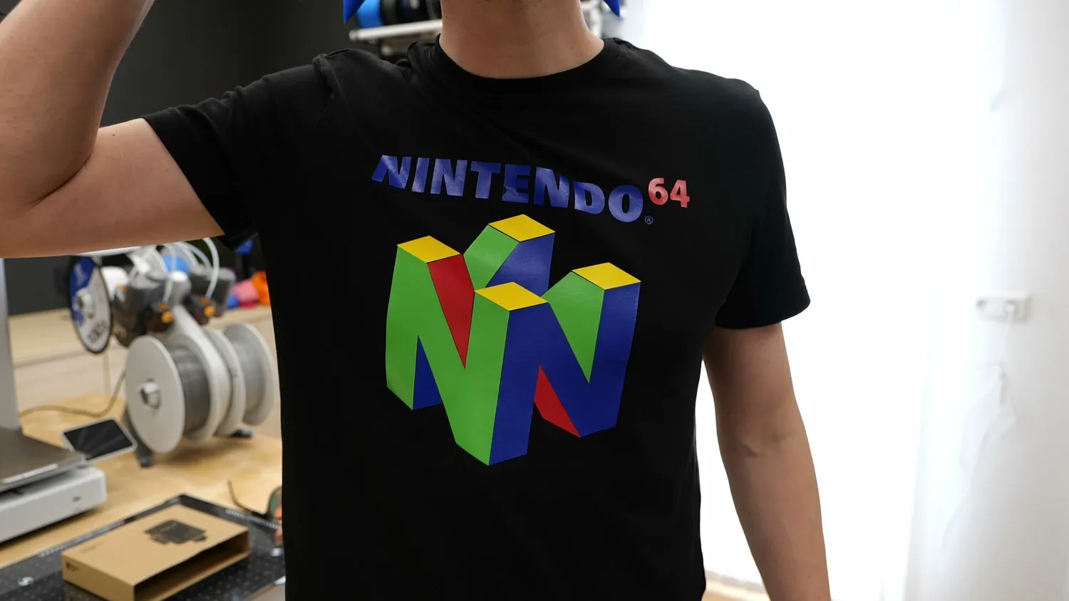 Wearing the finished T-shirt with the cut and ironed Nintendo 64 logo