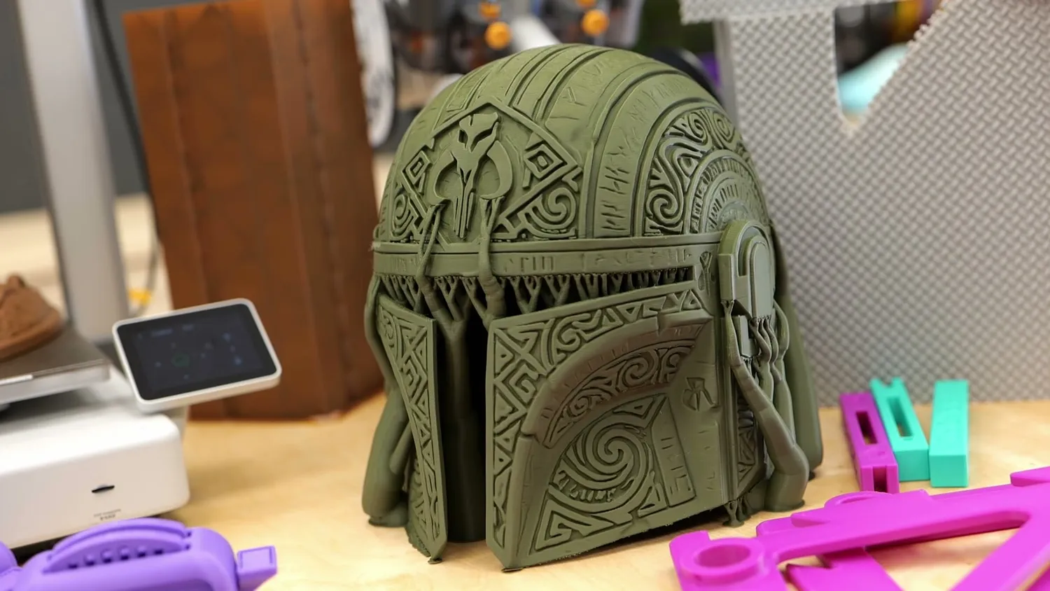 The printed Mandalorian helmet next to other parts made on the A2L
