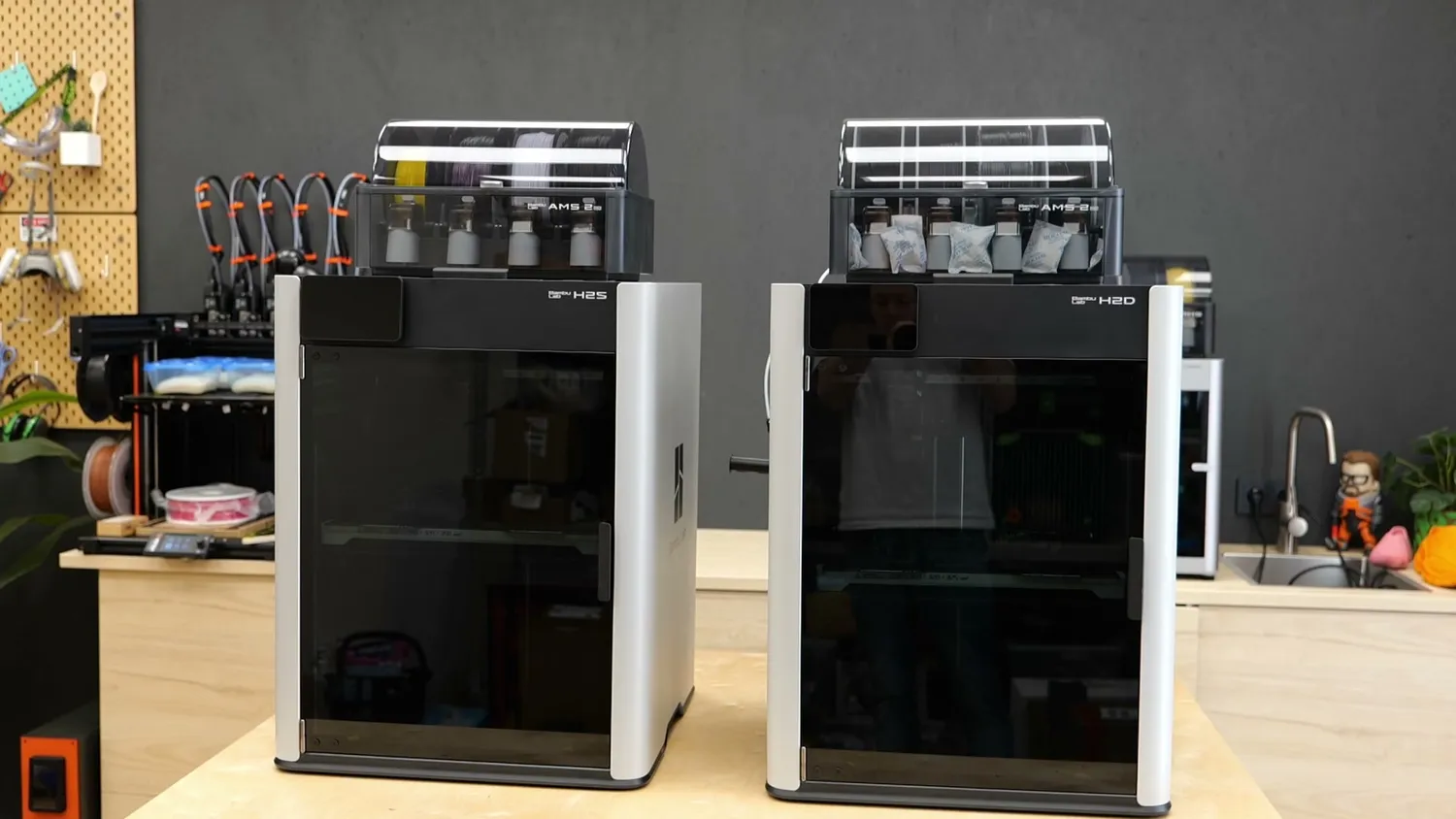 The H2S and H2D standing next to each other on a workbench
