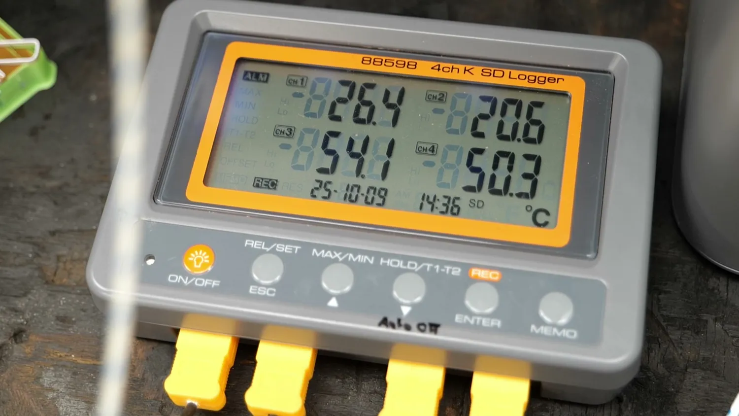 A four channel thermocouple logger reading 26.4, 20.6, 54.1 and 50.3 degrees Celsius