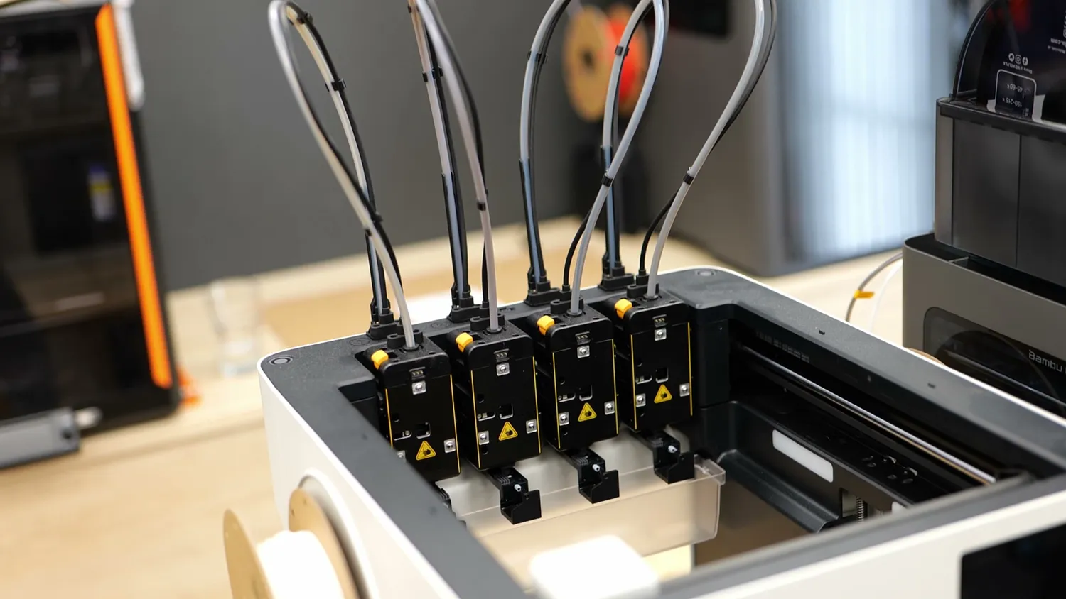 Four toolheads docked in the Snapmaker U1 toolchanger