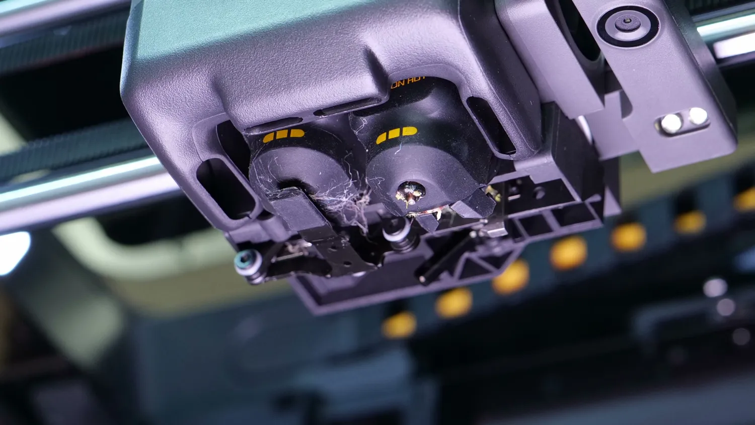 The underside of the X2D toolhead with both nozzles and the wiper mechanism