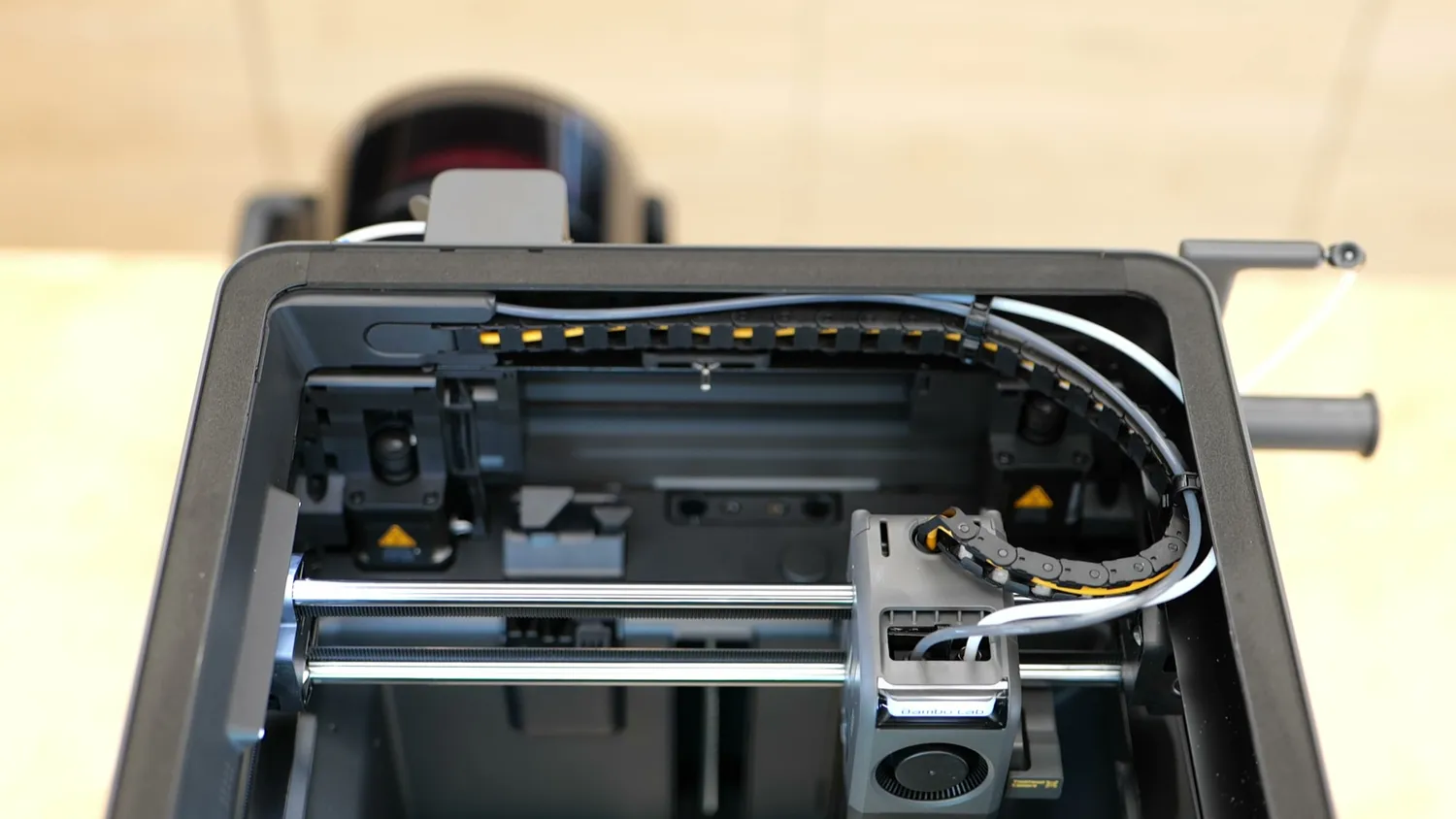 Top view of the X2D gantry with the bowden tube running into the toolhead