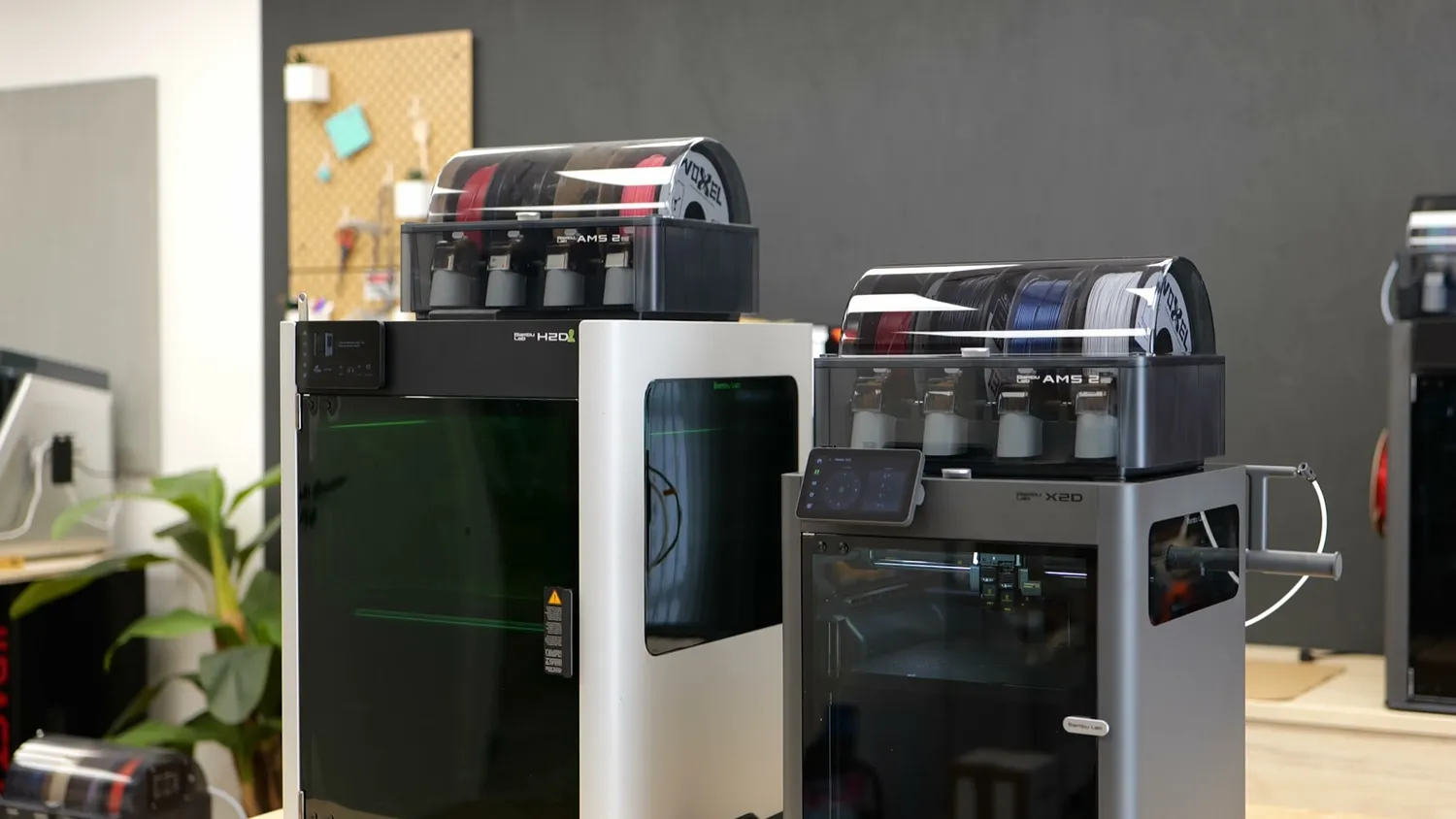 The Bambu Lab H2D standing next to the X2D
