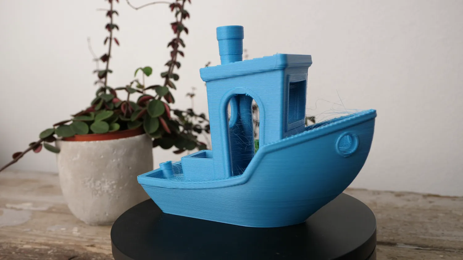 A 300% 3DBenchy printed with the CHT, its hull smooth with some wisps around the cabin