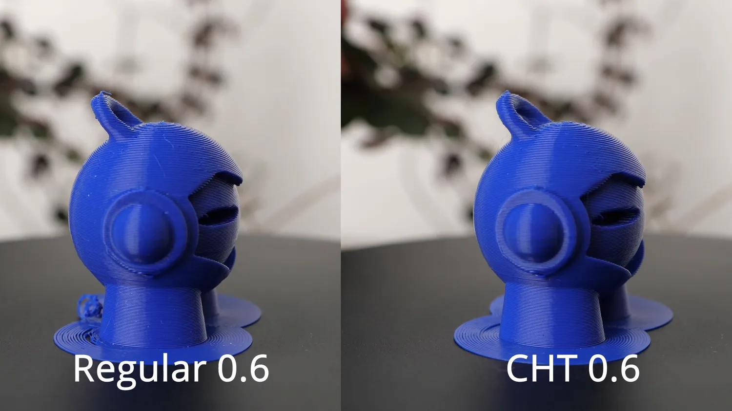 Marvin printed with a regular 0.6 mm nozzle next to the CHT 0.6, the overhang above the eye slightly cleaner on the CHT