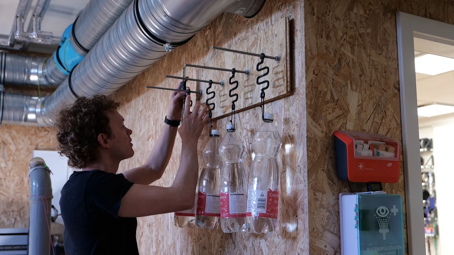  Measuring the length of the creep-springs on the wall 