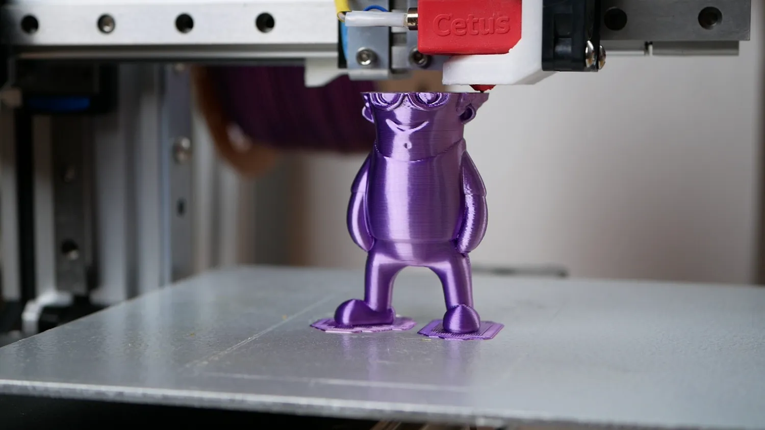 The converted Cetus printing a purple Mini Stefan, the surface glossy and evenly layered