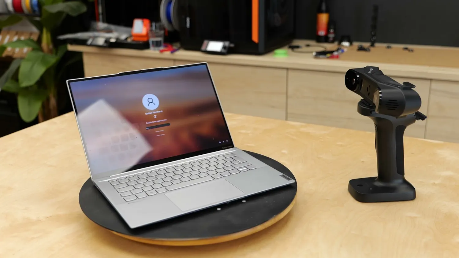 A thin laptop set up next to the scanner