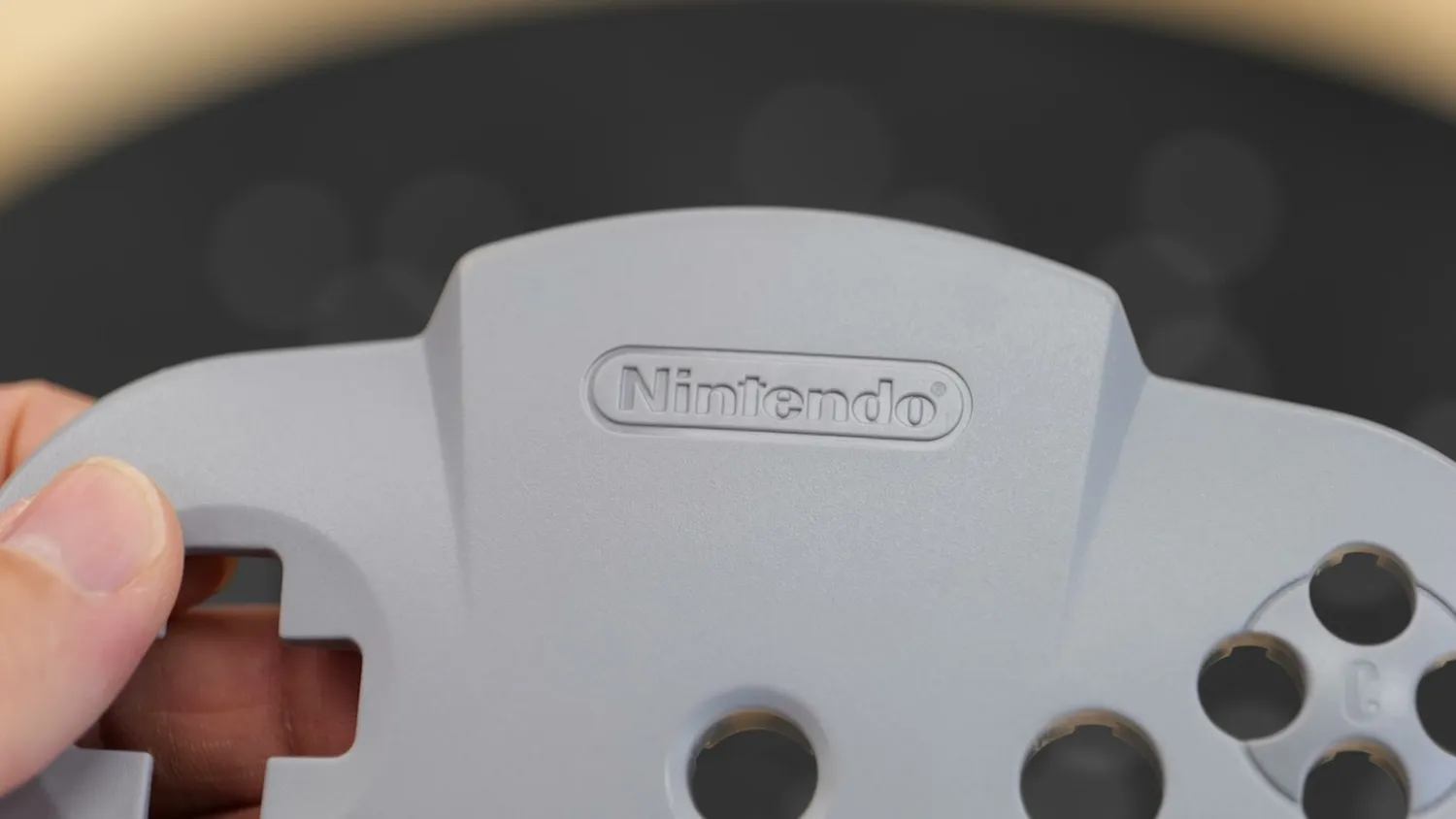 The front of the N64 controller shell with its embossed logo