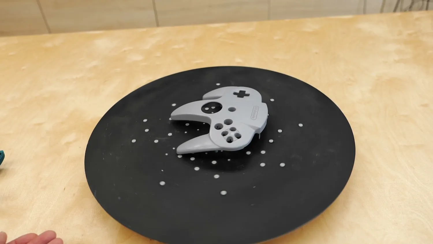 The controller shell on a marker-covered turntable