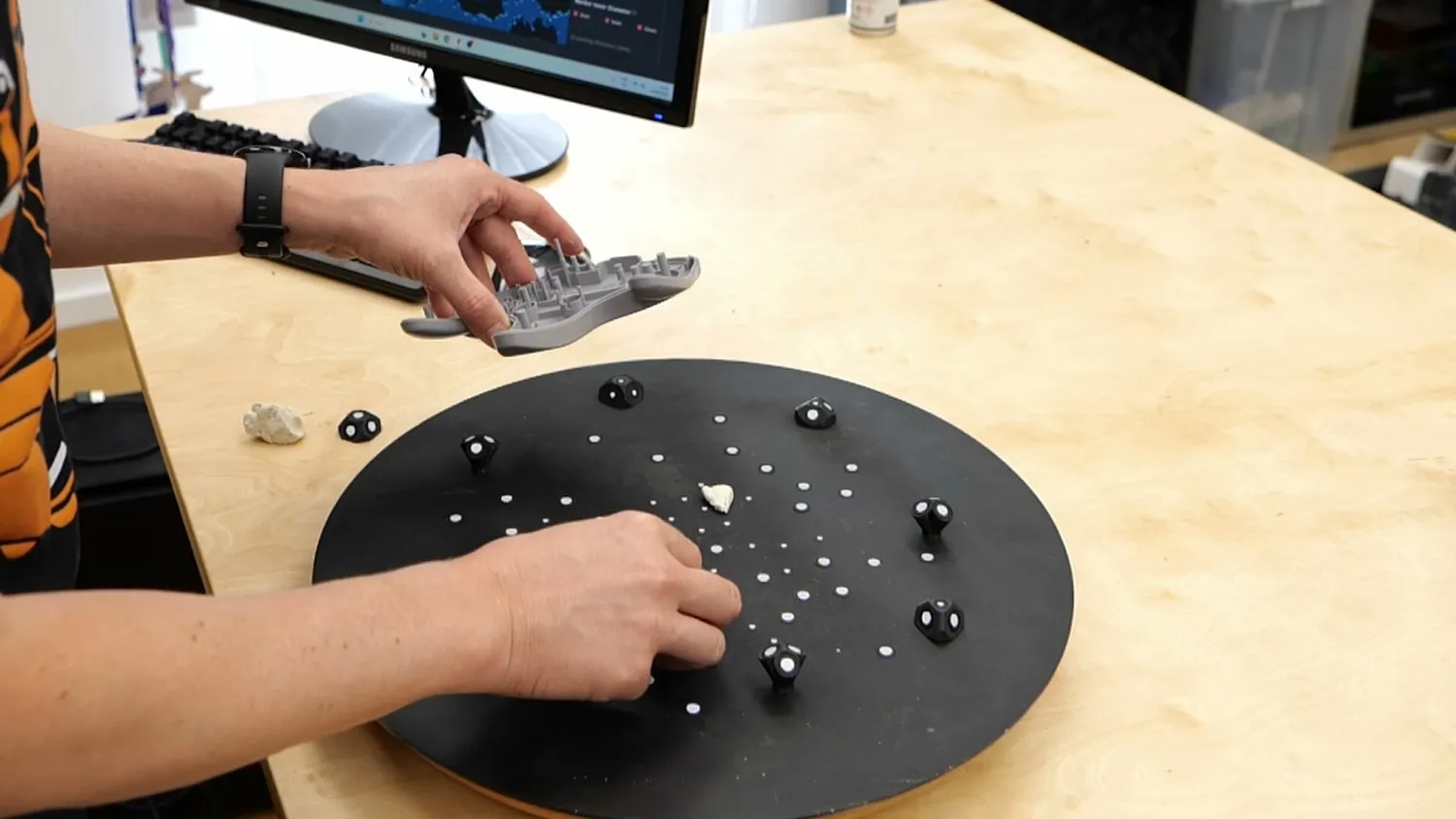 Pressing the shell onto blobs of modeling clay