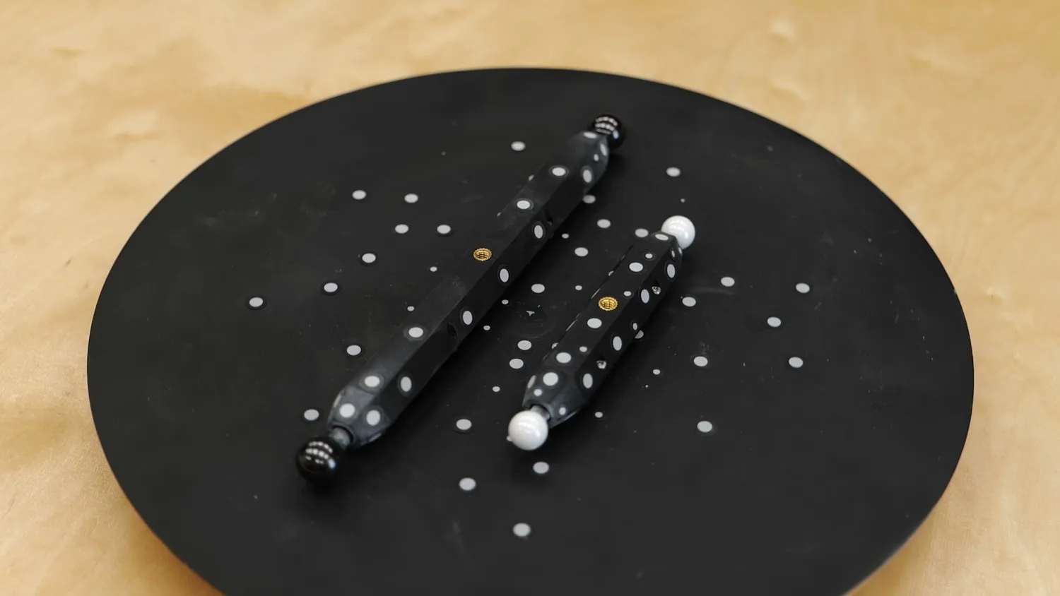 Two DIY ball bars on the scanning turntable