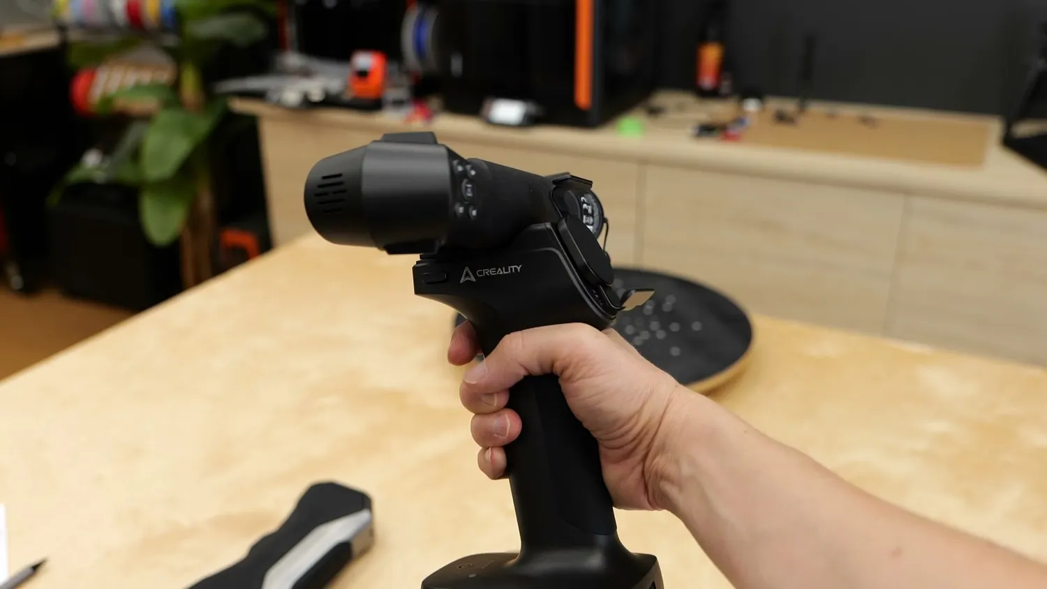 Holding the Raptor Pro by its pistol grip