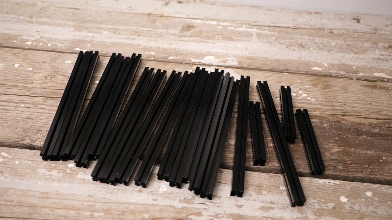 Aluminium extrusions, cut, drilled and tapped to length