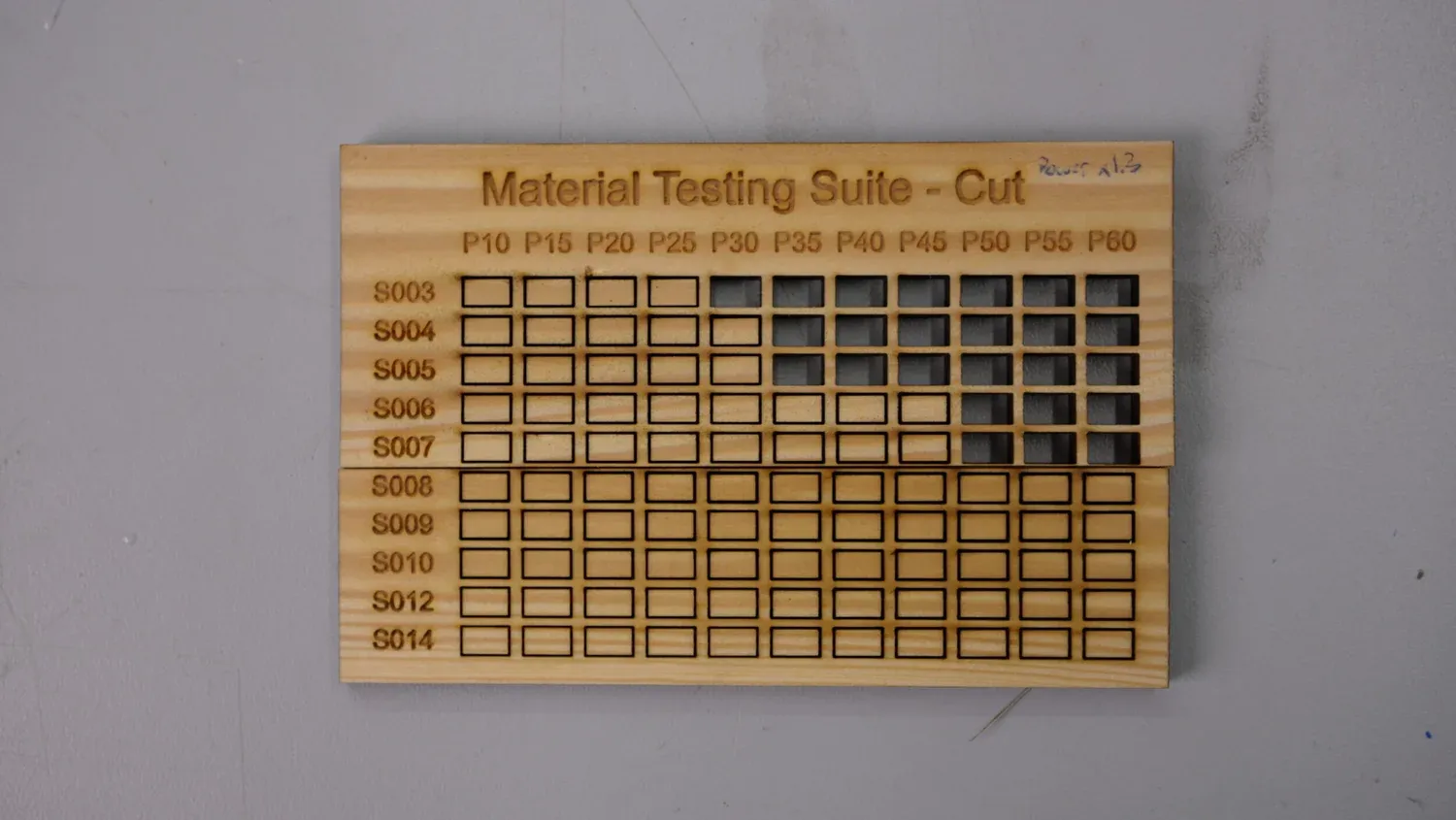 Cut test in pale poplar plywood marked Power x1.3, where the faster rows only cut through above P30