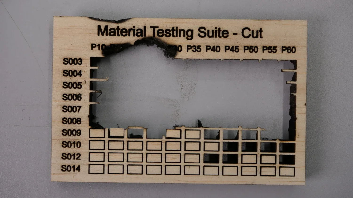 Thicker balsa where the sheet caught fire, leaving a large burnt hole through the middle of the grid