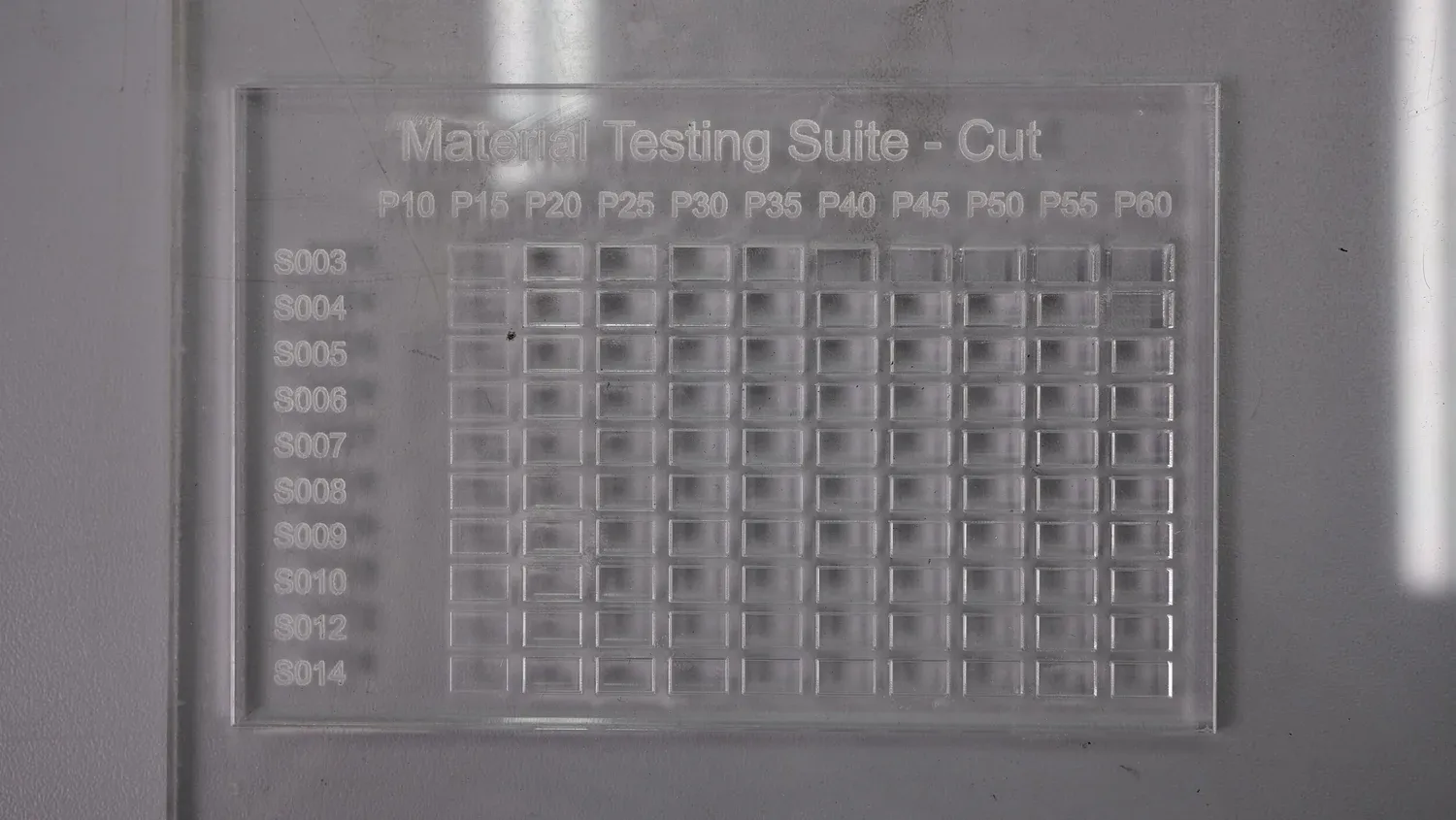5 mm clear acrylic, engraved rather than cut through at every setting