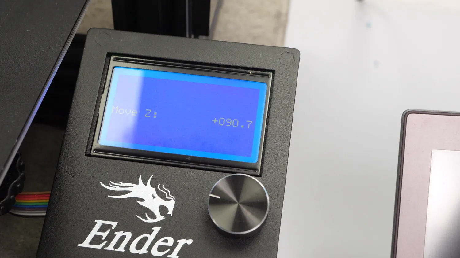 The Ender's LCD reading Move Z: +090.7 once the nozzle touches the last printed layer