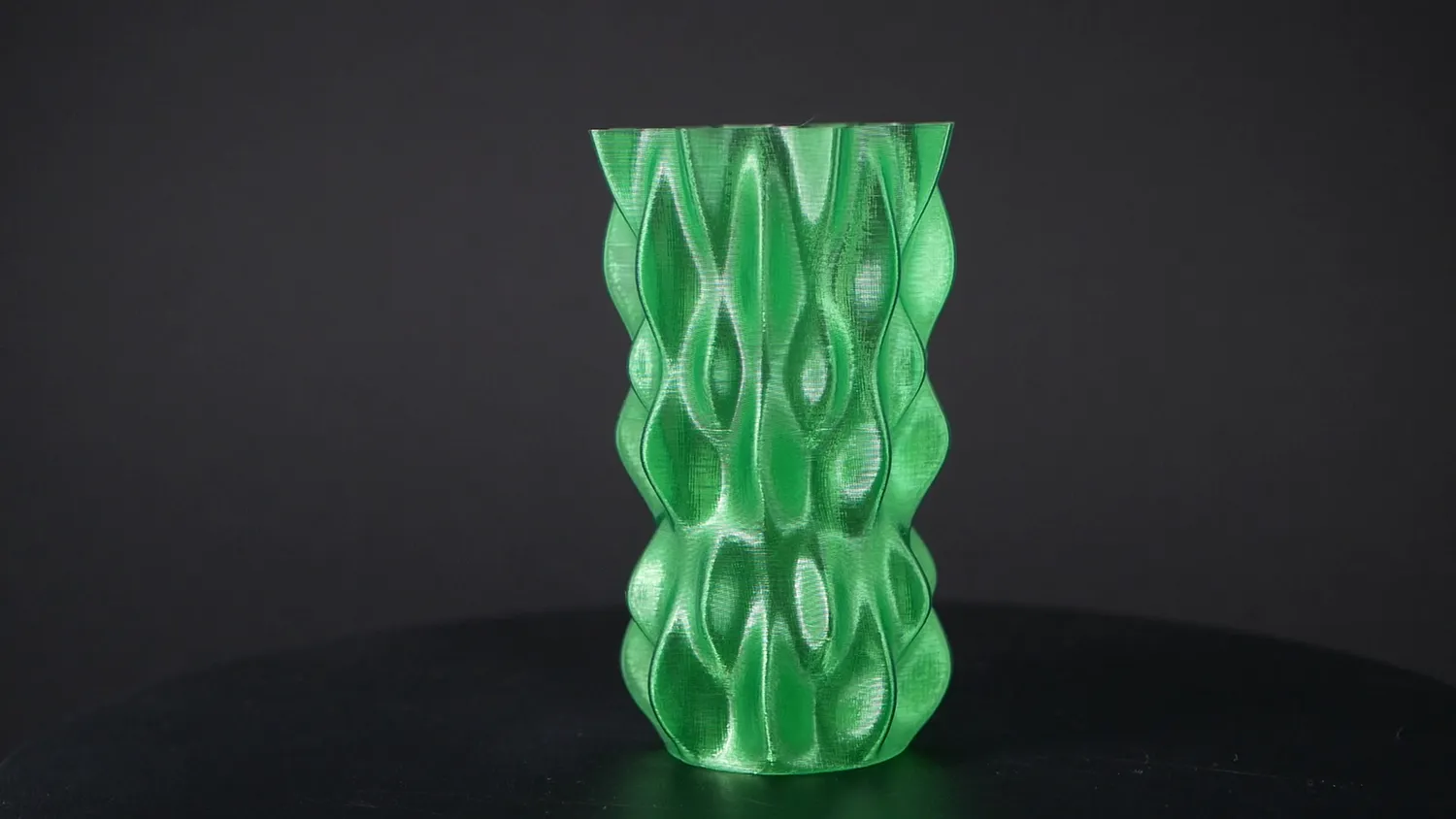 Wavy vase printed in translucent green bottle PET