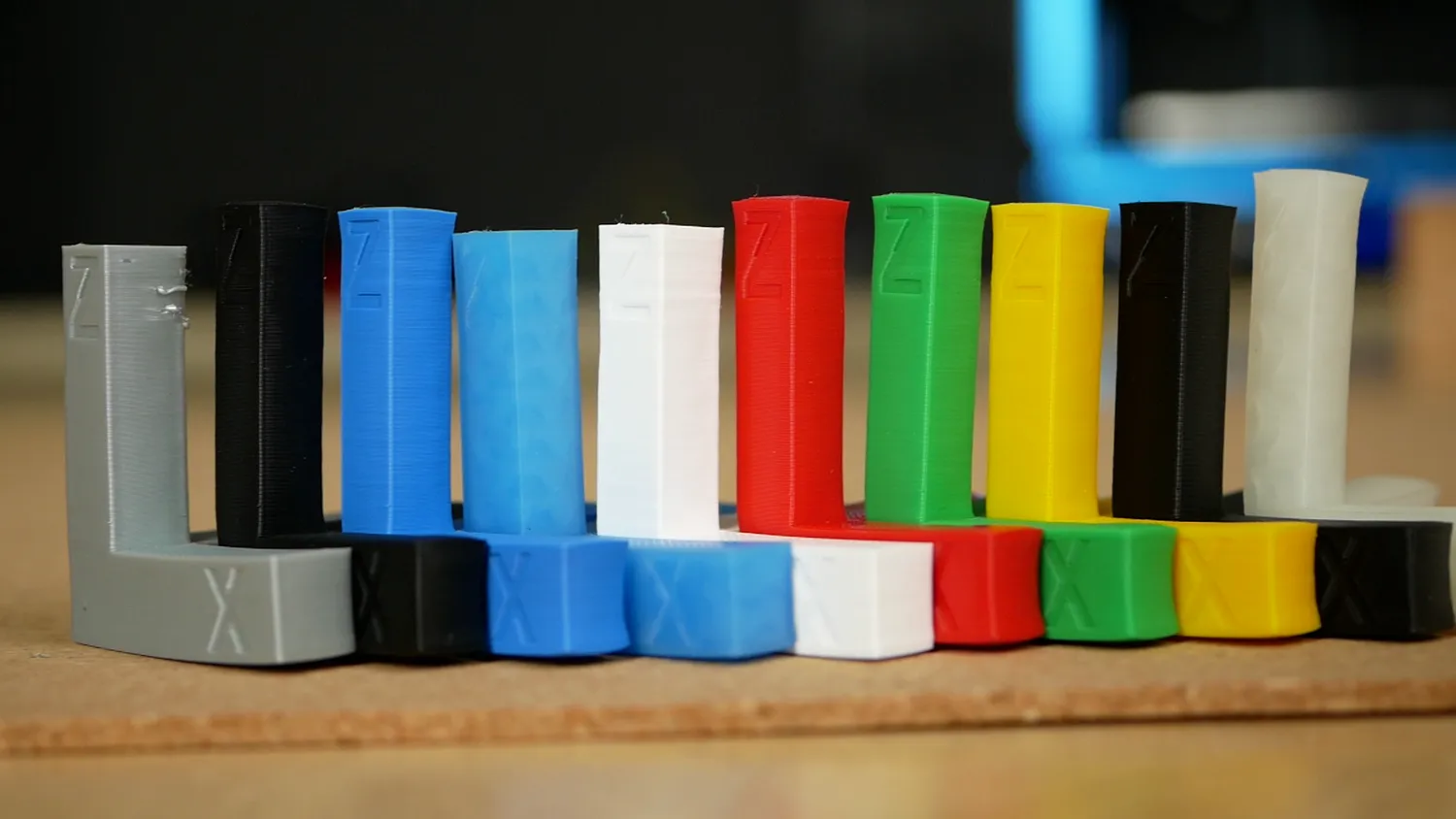 The annealed samples lined up by colour, each pair visibly shorter in x and y and taller in z than before
