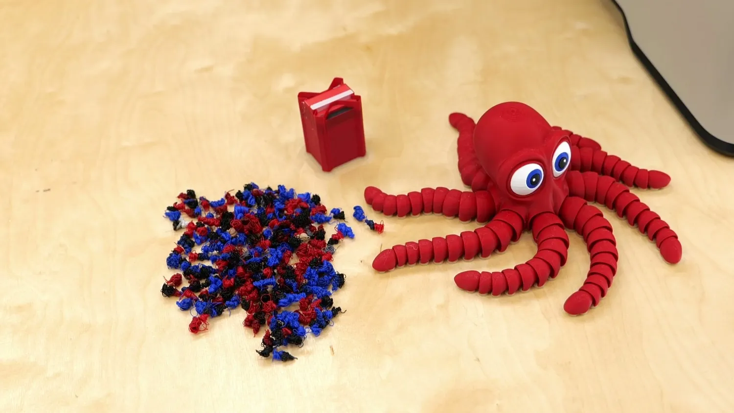 The five color flexi octopus next to the purge waste it produced