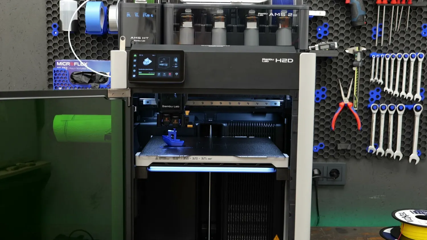 The Bambu Lab H2D printing in the workshop