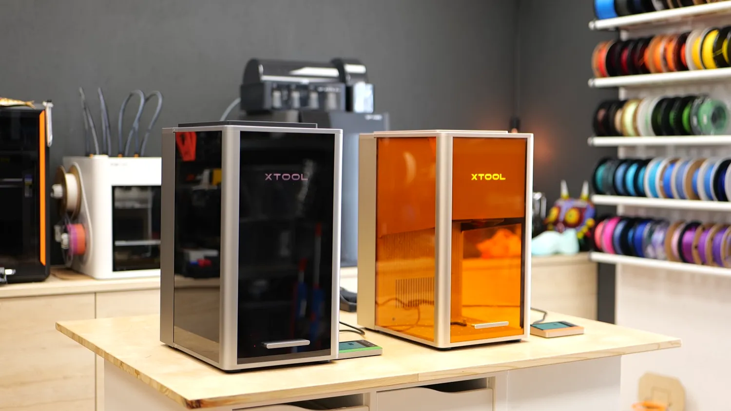 The xTool F2 Ultra and F2 Ultra UV standing next to each other in the CNC Kitchen studio