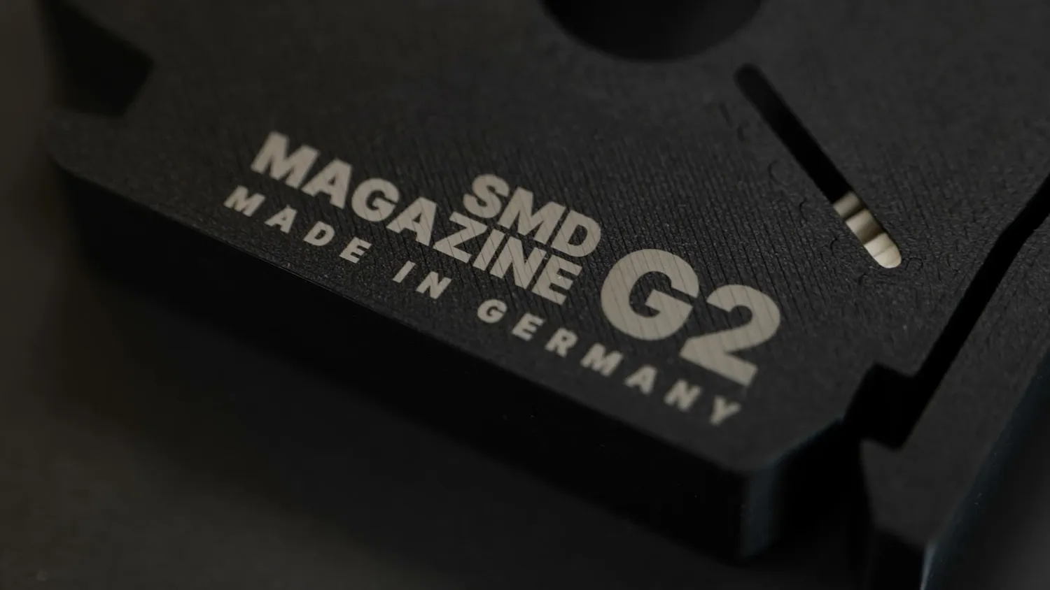 Black SMD magazine with a bright near-white SMD Magazine G2 marking