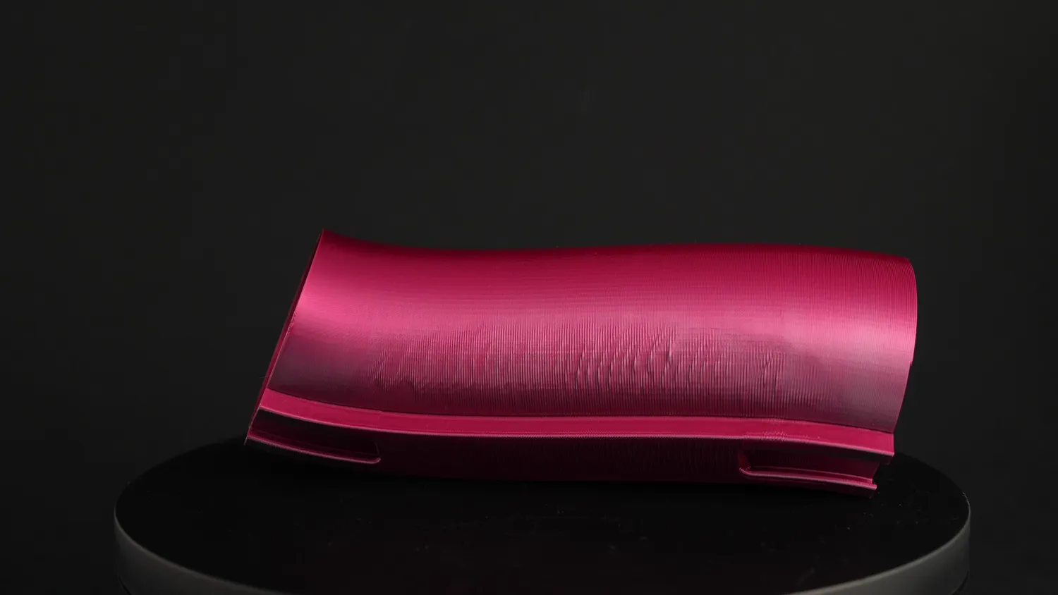 A pink section lying down, showing the curve along its whole length