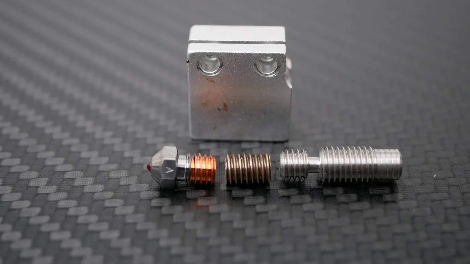Using regular size nozzles in longer heater blocks with spacers