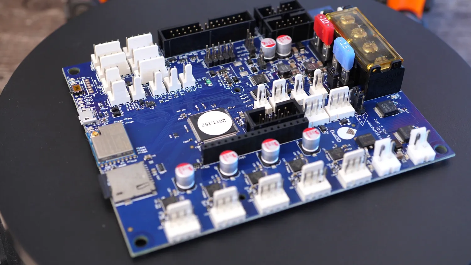 The Duet 3 Mini 5+ board, with its five stepper channels along the front edge, WiFi module, SD slot and screw terminals for power and bed