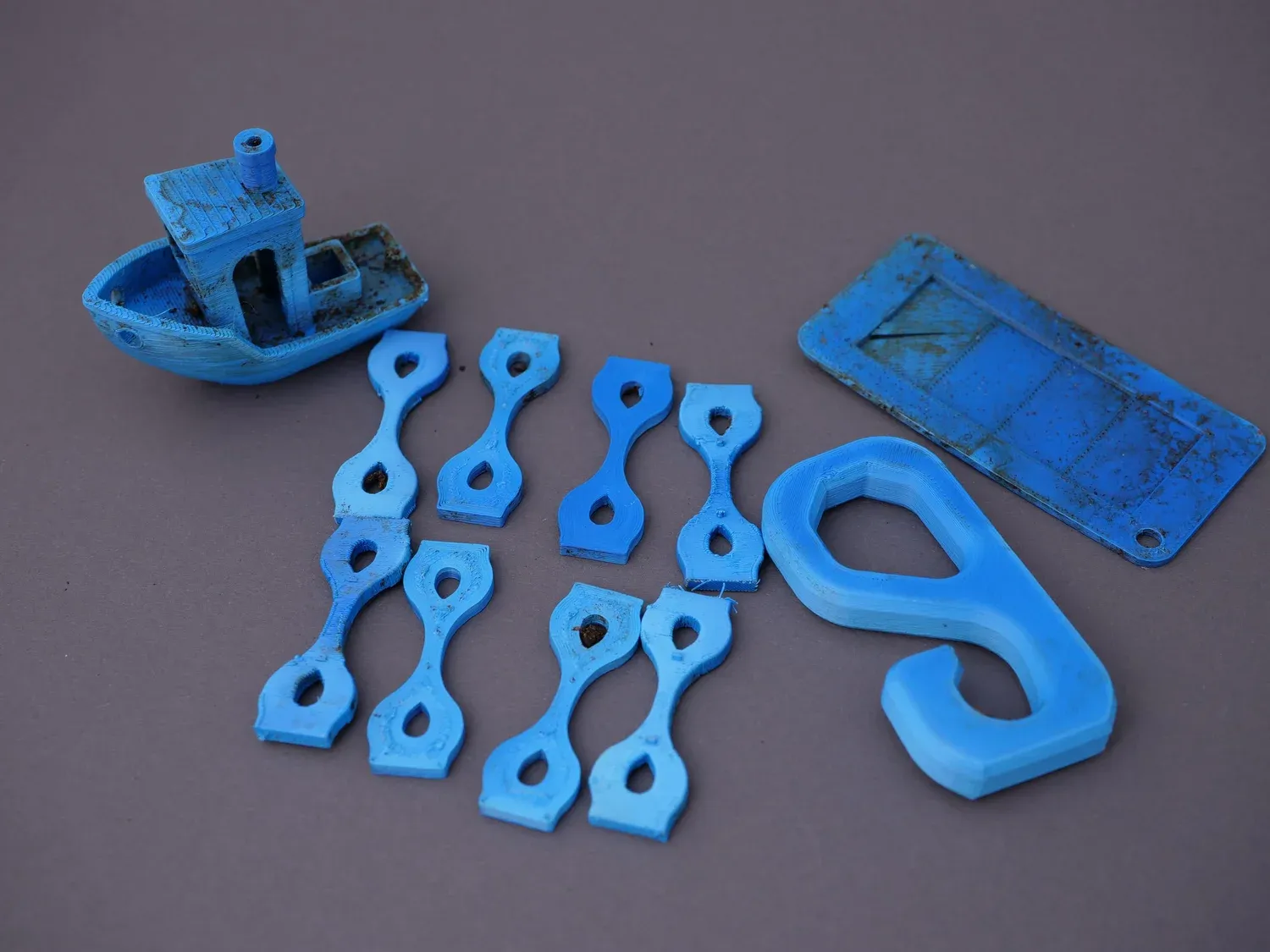 The blue PLA samples, dulled and dirty with no sign of the material breaking down