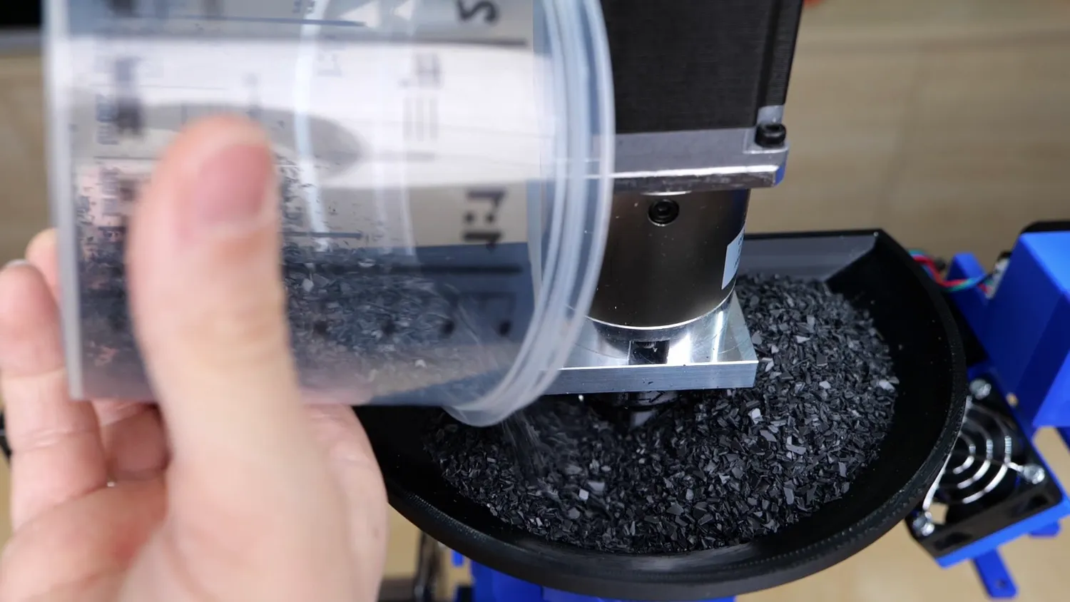  Adding the shredded material to the hopper 
