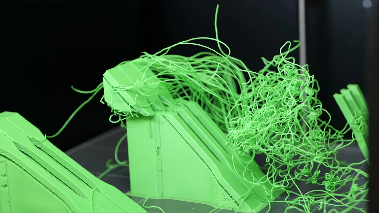 Failed angled print collapsed into a tangle of green strands