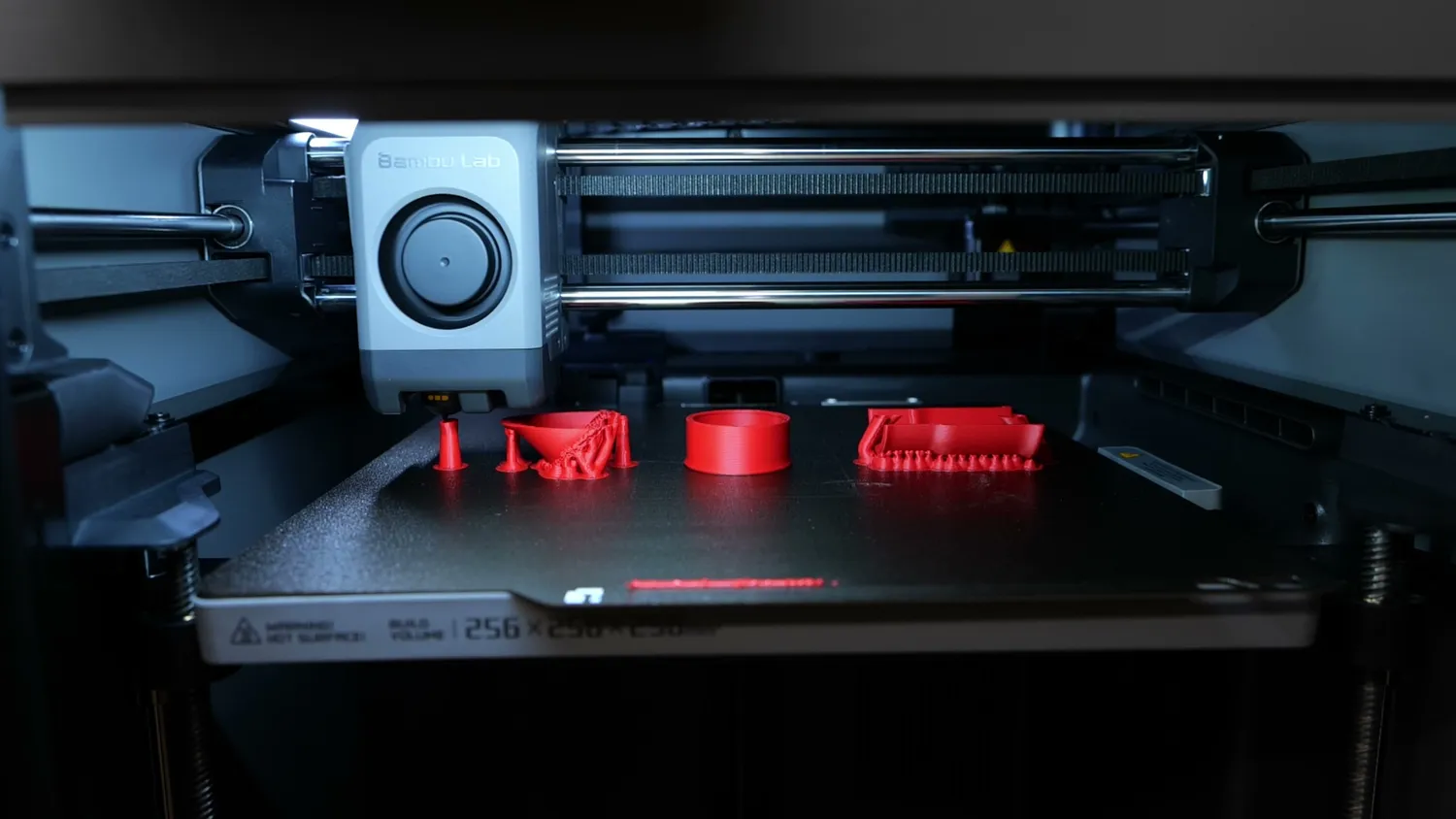Three vacuum hose adapters printing in different orientations